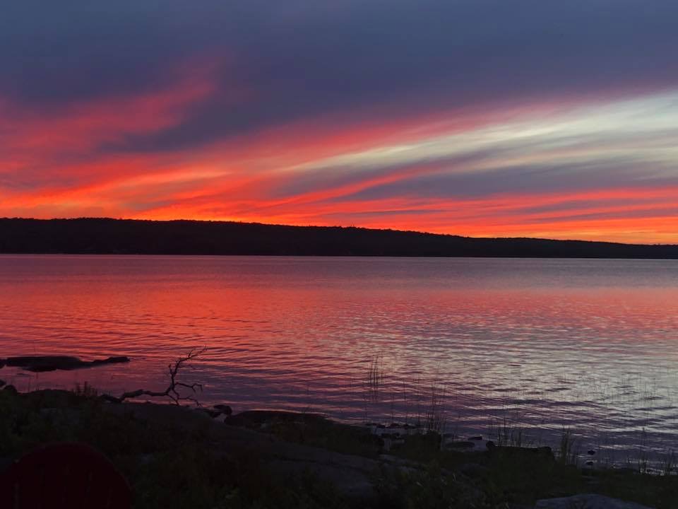 Beautiful dark red sunset over Sherbrooke Lake