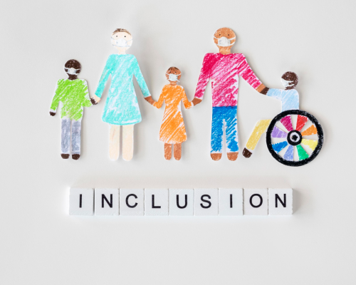 paper cutouts of people holding hands with "inclusion" below them