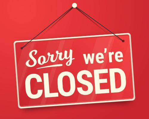 Sign with "Sorry we're closed" on a red background