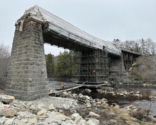 Scaffolding around center granite pier of Gold River Trail Bridge