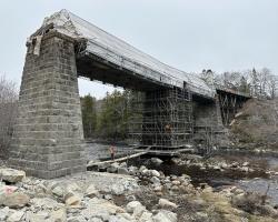 Scaffolding around center granite pier of Gold River Trail Bridge